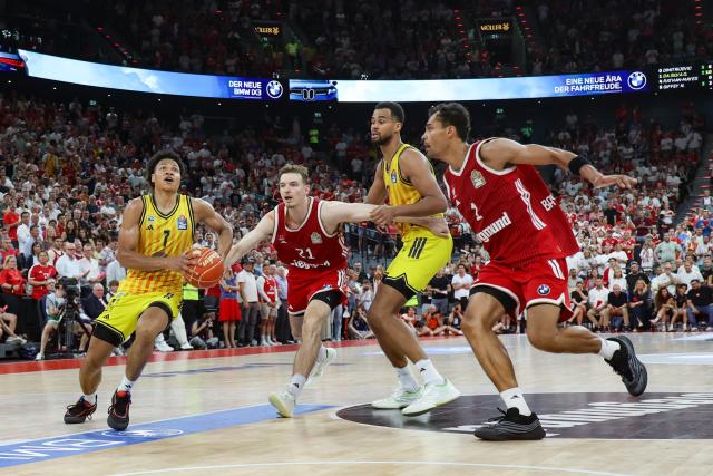 21 June 2026, Bavaria, Munich: ALBA Berlin's Jack Kayil (L) and Bayern Munich's Justus Hollatz battle for the ball during the German Basketball Bundesliga final match between ALBA Berlin and Bayern Munich at SAP Garden. Photo: Matthias Stickel/dpa