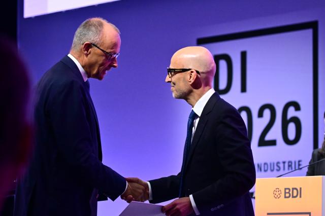 23 June 2026, Berlin: German Chancellor Friedrich Merz speaks Peter Leibinger, president of the Federation of German Industries (BDI), during the 2026 Industry Day event organized by the Federation of German Industries. Photo: Sebastian Gollnow/dpa
