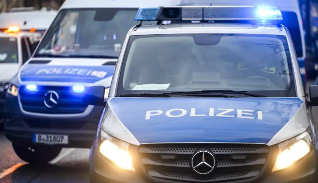FILED - 04 December 2024, Berlin: FILE PHOTO - Police cars with their headlights and blue lights on. Photo: Jens Kalaene/dpa