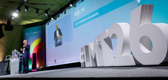 24 June 2026, Bavaria, Nuremberg: Thorsten Schmiege, president of the Bavarian State Office for New Media (BLM), speaks during the opening of the Local Media Days at the Nuremberg Exhibition Centre. Photo: Daniel Karmann/dpa