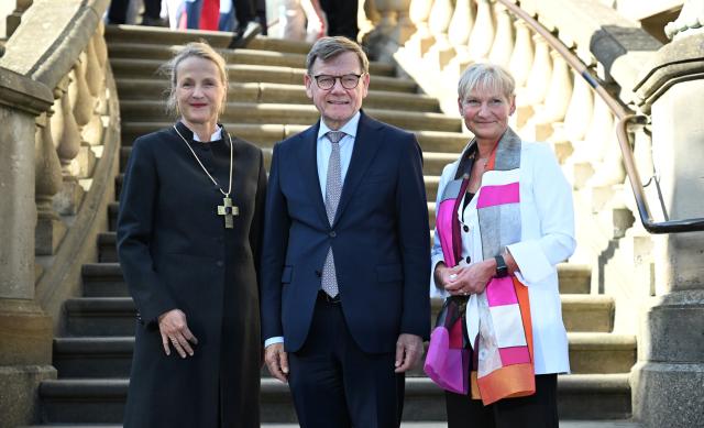 24 June 2026, Berlin: Anne Gidion (L-R), Protestant prelate, Johann Wadephul, Federal Minister of Foreign Affairs, and Bishop Kirsten Fehrs, Chair of the Executive Committee of the Evangelical Church in Germany (EKD), are attending the traditional St. John's Reception of the Evangelical Church in Germany (EKD) at the Franzoesische Friedrichstadtkirche in Berlin. Photo: Leonie Asendorpf/dpa