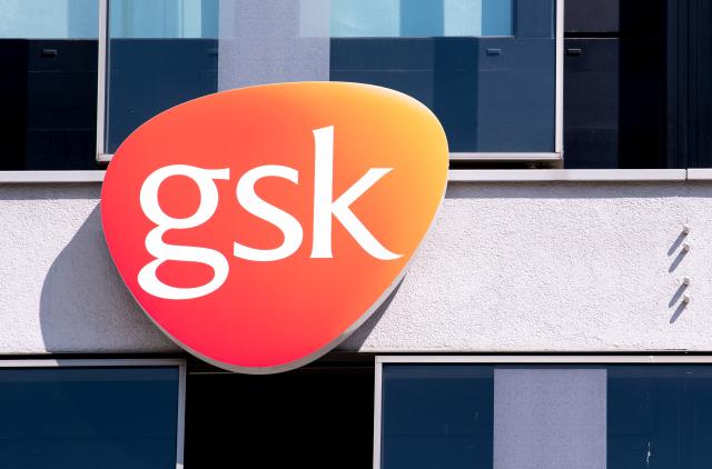 FILED - 19 April 2018, Bavaria, Munich: FILE PHOTO - The logo of British pharmaceutical giant GlaxoSmithKline (GSK) is pictured at the company's offices in Munich. Photo: Sven Hoppe/dpa