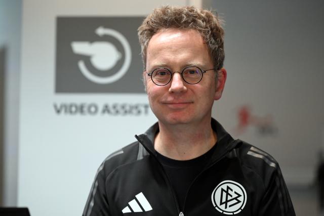 FILED - 14 March 2025, North Rhine-Westphalia, Cologne: FILE PHOTO - Alex Feuerherdt, Head of Communications and Media Relations at DFB Schiri GmbH, stands in front of the Video Assist Center. Photo: Federico Gambarini/dpa