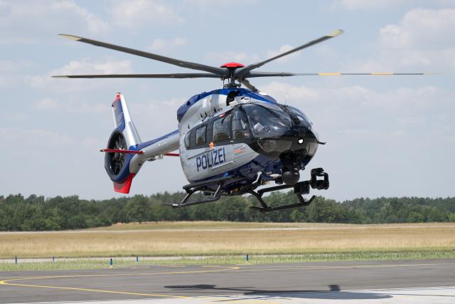 25 June 2026, Saxony, Dresden: A new Airbus H145 police helicopter lands at Dresden Airport during the commissioning ceremony. The new helicopters are more powerful and larger than their predecessors. Photo: Sebastian Kahnert/dpa