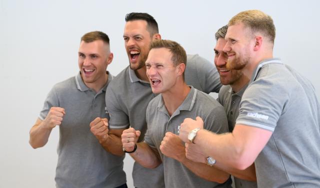 25 June 2026, Saxony, Dresden: German bobsled pilot Francesco Friedrich (C) and his teammates (L-R) Felix Straub, Georg Fleischhauer, Matthias Sommer, and Rupert Schenk pose for a celebratory photo after a press conference. The world's most successful bobsled pilot will continue his bobsledding career through the 2030 Winter Olympics. Photo: Robert Michael/dpa