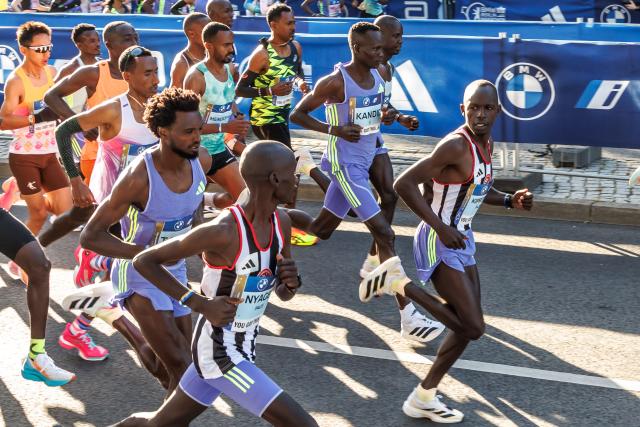 FILED - 29 September 2024, Berlin: FILE PHOTO- Ethiopian athlete Tadese Takele (L), Kenyan long-distance runner Kibiwott Kandie (3rd R) and other runners line up for the Track and Field Marathon in Berlin. Former half marathon world record holder Kibiwott Kandie has been banned for seven years for two breaches of anti-doping rules. Photo: Andreas Gora/dpa