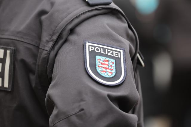 FILED - 23 February 2023, Thüringen, Erfurt: File Photo - Police officers stand in the courtyard of the Am Schwemmbach Municipal Comprehensive School during the launch of the Thuringian Police's recruitment campaign. Photo: Bodo Schackow/dpa