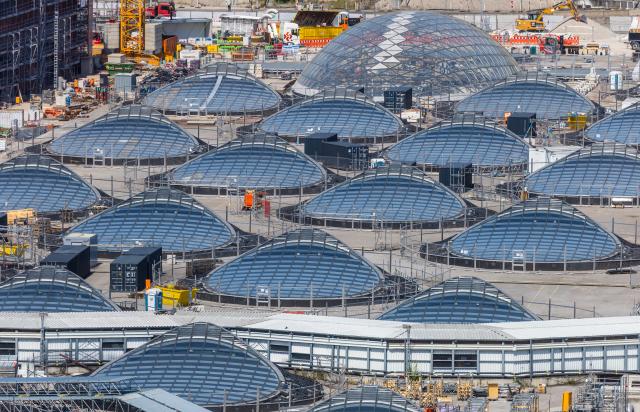 26 June 2026, Baden-Württemberg, Stuttgart: A view of the S21 construction site and the illuminated eyes of Stuttgart's future main station. Photo: Christoph Schmidt/dpa