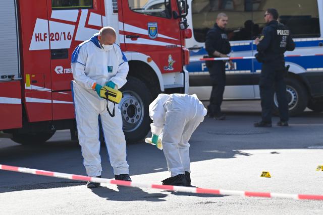 26 June 2026, Saxony-Anhalt, Haldensleben: Forensic investigators examine a crime scene on the edge of the market square as police conduct an operation following an incident in which at least one person was injured, according to the Magdeburg Police Department. Photo: Klaus-Dietmar Gabbert/dpa