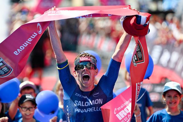 28 June 2026, Hesse, Frankfurt am Main: Norwegian triathlete Casper Stornes celebrates as he crosses the finish line to win the Mainova IRONMAN Frankfurt European Championship. Photo: Uwe Anspach/dpa