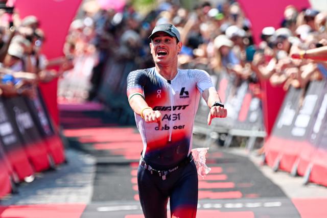 28 June 2026, Hesse, Frankfurt am Main: Norwegian triathlete Gustav Iden smiles and celebrates after crossing the finish line to secure second place at the Mainova IRONMAN Frankfurt European Championship. Photo: Uwe Anspach/dpa