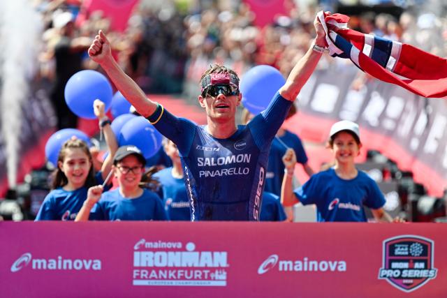 28 June 2026, Hesse, Frankfurt am Main: Norwegian triathlete Casper Stornes celebrates as he crosses the finish line to win the Mainova IRONMAN Frankfurt European Championship. Photo: Uwe Anspach/dpa