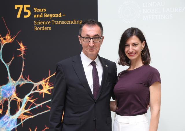 28 June 2026, Bavaria, Lindau (Bodensee): Cem Oezdemir, Minister-President of Baden-Wuerttemberg, and his wife, Flavia Zaka, attend the opening of the 75th Nobel Laureates Conference. Photo: Karl-Josef Hildenbrand/dpa