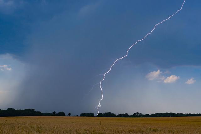 28 June 2026, Brandenburg, Sieversdorf: A flash of lightning illuminates the landscape in eastern Brandenburg. Photo: Patrick Pleul/dpa