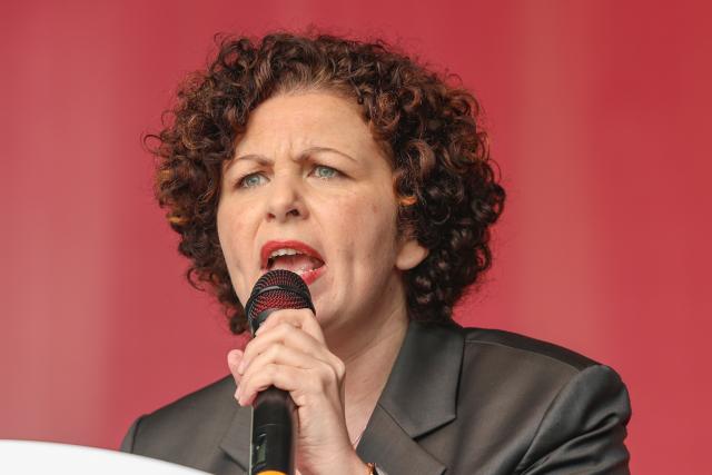 FILED - 13 June 2026, Saxony-Anhalt, Magdeburg: FILE PHOTO - Amira Mohamed Ali, national chair of the Sahra Wagenknecht Alliance (BSW), addresses participants at the BSW rally held under the slogan "Merz must go! Against energy rip-offs and the economic crisis" on the station plaza in the state capital. Photo: Peter Gercke/dpa