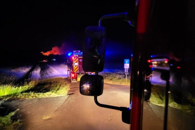 HANDOUT - 29 June 2026, Bavaria, Übersee: Firefighters are battling a forest fire in the area of the municipality of Übersee am Chiemsee. As a result, the nearby A8 is completely closed. Photo: Wolfgang Gasser/Kreisfeuerwehrverband Traunstein/dpa - ATTENTION: For editorial use only in connection with current news coverage, and only with full attribution as stated above