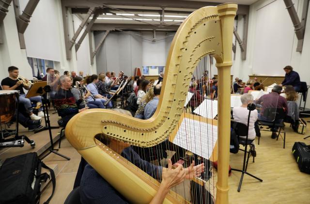 FILED - 10 September 2019, Mecklenburg-Western Pomerania, Rostock: FILE PHOTO - Musicians from the Norddeutsche Philharmonie orchestra rehearse at the Haus der Musik. Photo: Bernd Wüstneck/dpa-Zentralbild/dpa