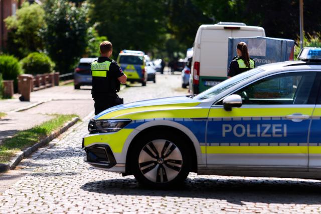 29 June 2026, Lower Saxony, Stade: Police officers stand in front of a youth facility, where several people were killed by gunfire. Two suspects have been arrested, a police spokesperson confirmed in response to an inquiry by the German Press Agency (Dpa). Photo: Marcus Golejewski/dpa