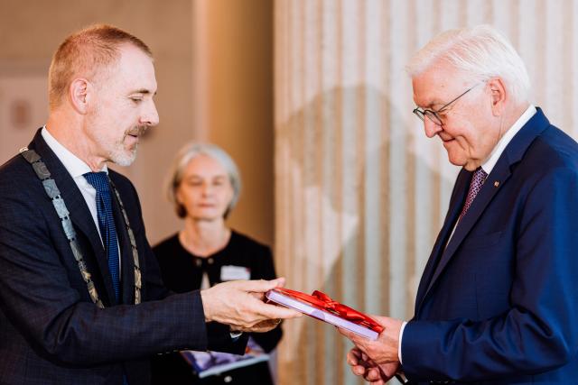 30 June 2026, Baden-Württemberg, Lörrach: Joerg Lutz (L), mayor of Loerrach, speaks with German President Frank-Walter Steinmeier after the signing of the Golden Book of the city of Loerrach. For three days, Steinmeier will conduct his official duties from this city in the "Three-Country Corner," very close to Switzerland and France, as part of his 
"Local Time Germany" tour, where he leaves his official residence in Berlin to visit regions outside the major cities in order to engage in conversation with local residents. Photo: Philipp von Ditfurth/dpa