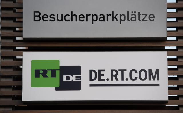 FILED - 29 September 2021, Berlin: FILE PHOTO - The sign of Russian international broadcaster RT DE hangs outside an office building in Adlershof. Photo: Paul Zinken/dpa