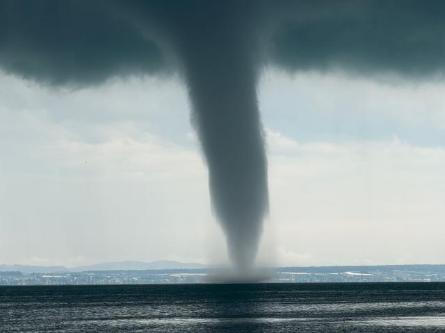 01 July 2026, Baden-Württemberg, Wasserburg (Bodensee): A waterspout has formed over Lake Constance (best available quality). Photo: Kraus/swd-medien/dpa