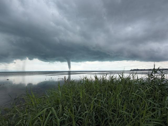 01 July 2026, Baden-Württemberg, Wasserburg (Bodensee): A waterspout has formed over Lake Constance (best available quality). Photo: Kraus/swd-medien/dpa