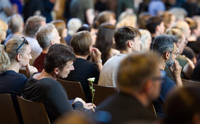 01 July 2026, Lower Saxony, Hanover: People attend a memorial service for those killed at the Marktkirche in Stade. Several people are killed in a shooting at a youth centre in Stade on 29 June 2026. Photo: Moritz Frankenberg/dpa