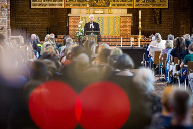 01 July 2026, Lower Saxony, Hanover: Rainer Mueller-Brandes (C), City Superintendent of the Hanover Church District, leads a memorial service for the deceased in Stade at the Marktkirche. On June 29, 2026, several people were killed in a shooting at a youth center in Stade.s Photo: Moritz Frankenberg/dpa