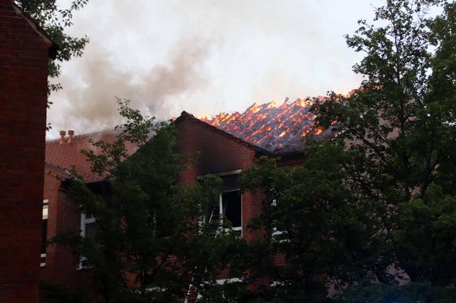 02 July 2026, Mecklenburg-Western Pomerania, Ludwigslust: Smoke rises from a hospital's roof, where several people were injured in a fire in Ludwigslust. Photo: Ralf Drefin/SWM DV Studio/dpa