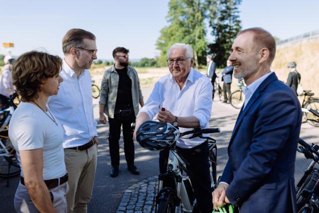 02 July 2026, Baden-Württemberg, Loerrach: (L-R) Christine Kaufmann, mayor of Riehen; Conradin Cramer, President of the Government of the Canton of Basel-Stadt, German President Frank-Walter Steinmeier, and Joerg Lutz, Mayor of Loerrach, stand at the German-Swiss border. For three days, Steinmeier will carry out his official duties from the town in the "Three-Country Corner," very close to Switzerland and France. As part of his "Ortszeit Deutschland" (Local Time Germany) series of visits, Steinmeier reportedly leaves his official residence in Berlin to visit regions outside the major cities and engage in conversation with citizens there. Photo: Philipp von Ditfurth/dpa