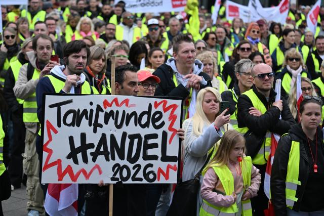 FILED - 15 May 2026, North Rhine-Westphalia, Dortmund: FILE PHOTO - Retail workers take part in a demonstration in front of the Soccer Museum. As part of the ongoing collective bargaining negotiations in the retail sector, Verdi has called for warning strikes. Photo: Federico Gambarini/dpa