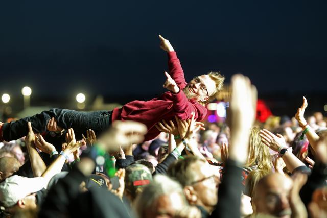02 July 2026, Saxony-Anhalt, Ballenstedt: Visitors attend the Rockharz Festival in Ballenstedt. The largest rock festival in the Harz Mountains attracts around 25,000 visitors. Numerous bands perform at Rockharz over the course of four days. Photo: Matthias Bein/dpa