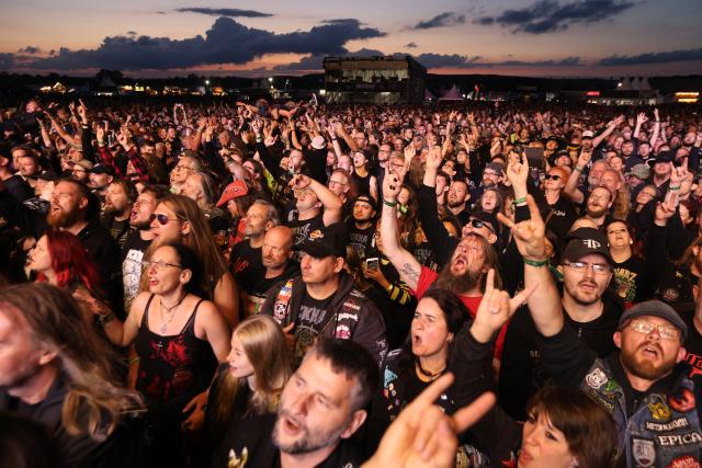 02 July 2026, Saxony-Anhalt, Ballenstedt: Visitors attend the Rockharz Festival in Ballenstedt. The largest rock festival in the Harz Mountains attracts around 25,000 visitors. Numerous bands perform at Rockharz over the course of four days. Photo: Matthias Bein/dpa