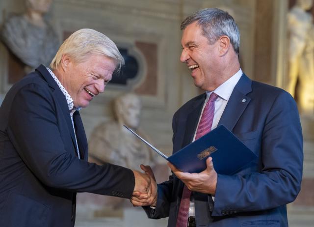 03 July 2026, Bavaria, Munich: Former goalkeeper Oliver Kahn (L), is presented with the Bavarian Order of Merit by Markus Soeder, Minister-President of Bavaria. The Bavarian Order of Merit is awarded "as a token of honor and gratitude for outstanding service to the Free State of Bavaria and the Bavarian people." Photo: Peter Kneffel/dpa