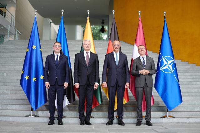 03 July 2026, Berlin: (L-R) Kristen Michal, Prime Minister of Estonia; Gitanas Nauseda, President of Lithuania, German Chancellor Friedrich Merz and and Edgars Rinkevics, President of Latvia, pose for a photo ahead of the Baltic Heads of State and Government meeting on preparations for the NATO summit in Ankara, security and defense policy, and continued support for Ukraine. Photo: Kay Nietfeld/dpa