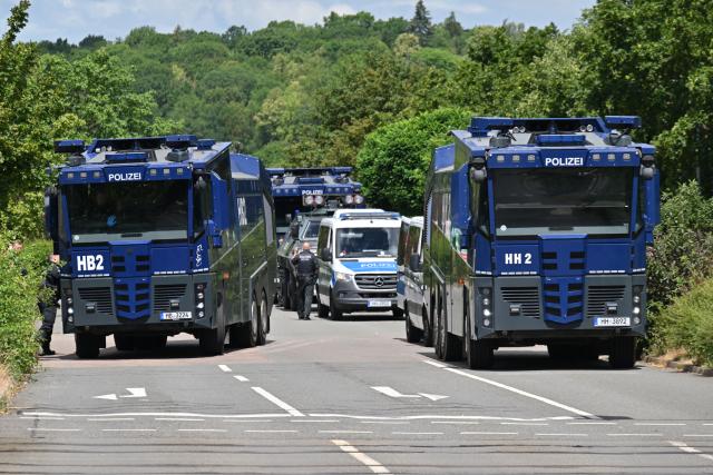 03 July 2026, Thuringia, Erfurt: Police water cannons are stationed near the Erfurt Exhibition Center. The Alternative for Germany's (AfD) national party convention will take place at the Erfurt Exhibition Center on July 4 and 5. Photo: Martin Schutt/dpa