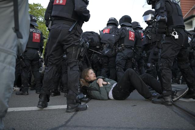 04 July 2026, Thuringia, Erfurt: Police officers drag a protester during a demonstration against the national party convention of the Alternative for Germany (AfD) pary. The AfD's national party convention is taking place on July 4 and 5 at the Erfurt Convention Center. Photo: Jacob Schröter/dpa