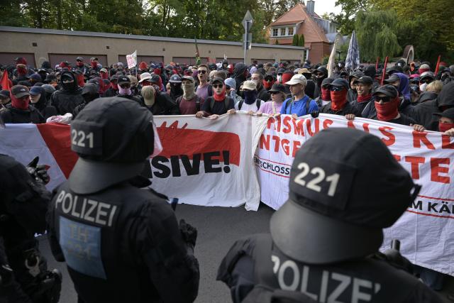 04 July 2026, Thuringia, Erfurt: Left-wing protestors hold a large banner during a demonstration against the national party convention of the Alternative for Germany (AfD) party. The AfD's national party convention is taking place on July 4 and 5 at the Erfurt Convention Center. Photo: Jacob Schröter/dpa