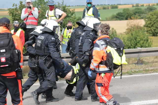 04 July 2026, Thuringia, Erfurt: Police carry a protestor during a demonstration against the national party convention of the Alternative for Germany (AfD) party. The AfD's national party convention is taking place on July 4 and 5 at the Erfurt Convention Center. Photo: Michael Reichel/dpa