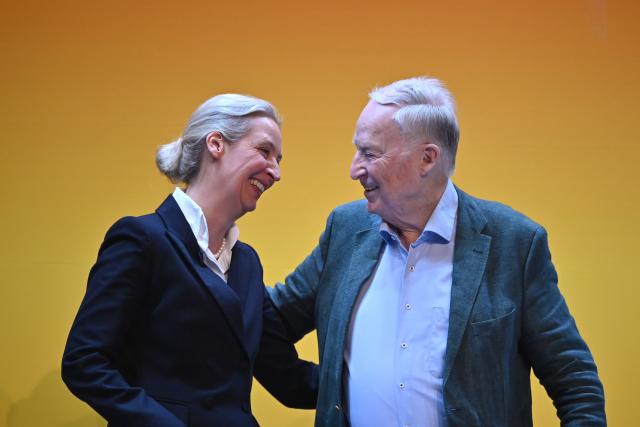 04 July 2026, Thuringia, Erfurt: Alice Weidel, federal chairwoman and parliamentary group leader of the Alternative for Germany (AfD), and Alexander Gauland (AfD) embrace during the AfD's federal party convention. The party's leadership is set to be re-elected at the convention. The AfD's national party convention will take place on July 4 and 5 at the Erfurt Exhibition Center. Photo: Katharina Kausche/dpa