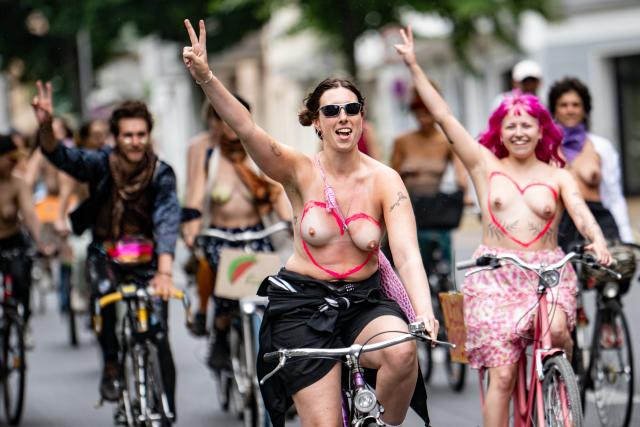 04 July 2026, Berlin: People with their tops off participate in a bicycle demonstration with the slogan "We are coming out-free the nipple-gender equality" for Equality and Self-Determination. Photo: Fabian Sommer/dpa