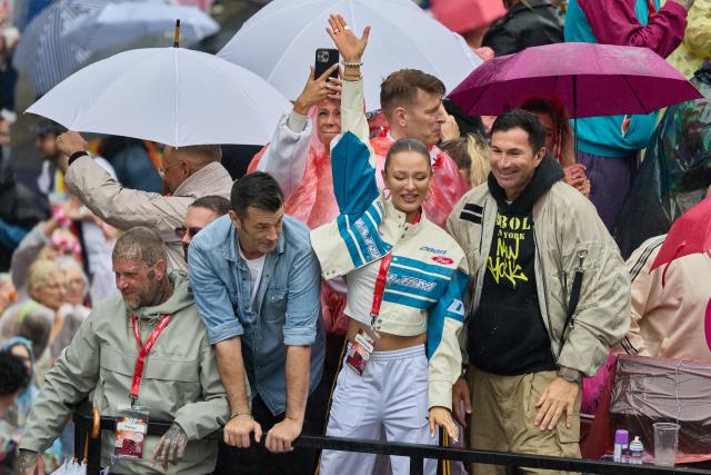 04 July 2026, Hamburg: Musicians Achim Petry (2nd L), Joelina Drews (C) and Lucas Cordalis (R) stand on a truck during the 2026 Schlagermove parade. Photo: Georg Wendt/dpa