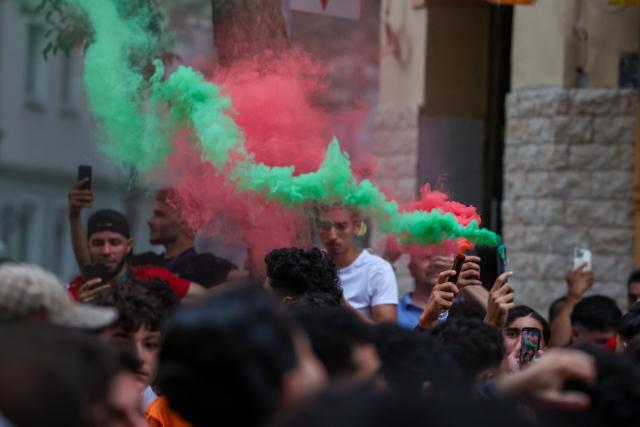 04 July 2026, North Rhine-Westphalia, Duesseldorf: Moroccan fans celebrate after their victory over Canada in the 2026 FIFA World Cup Round of 16 soccer match. Photo: Christoph Reichwein/dpa