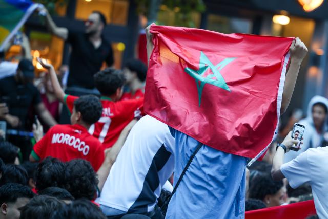 04 July 2026, North Rhine-Westphalia, Duesseldorf: Moroccan fans celebrate after their victory over Canada in the 2026 FIFA World Cup Round of 16 soccer match. Photo: Christoph Reichwein/dpa