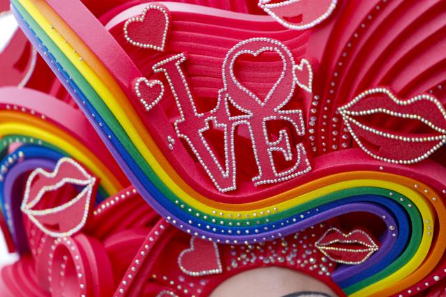 05 July 2026, North Rhine-Westphalia, Cologne: A participant wears a hat bearing the word "Love" during the Christopher Street Day parade. Photo: Thomas Banneyer/dpa