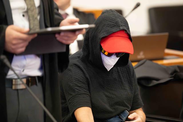 06 July 2026, Hesse, Kassel: A defendant takes her seat in the regional court for the trial regarding the food scandal at the former sausage manufacturer Wilke. The former managing director and two other former senior executives are charged with, among other things, negligent homicide and violations of food safety laws in connection with serious hygiene violations. Photo: Swen Pförtner/dpa