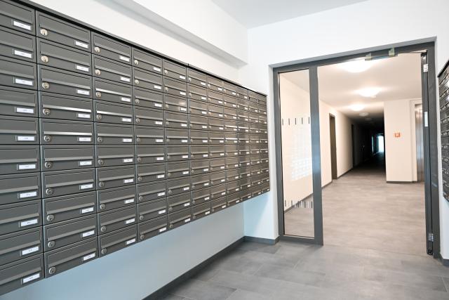 06 July 2026, Berlin: Numbered mailboxes can be seen in the entrance of an apartment building on Storkower Strasse, before the opening of Berlin's first dormitory for apprentices. Photo: Soeren Stache/dpa