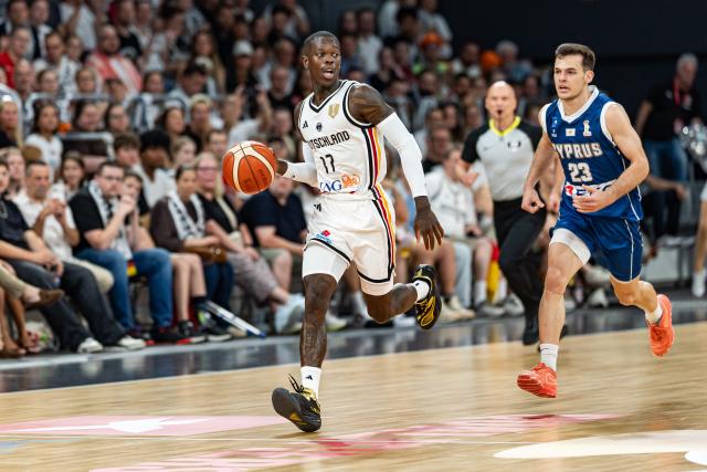06 July 2026, Bavaria, Bamberg: Germany's Dennis Schroeder (L) and Cyprus' Stefanos Tigkas battle for the ball during the Basketball World Cup Qualifiers Group E Basketball match between Germany and Cyprus. Photo: Daniel Löb/dpa