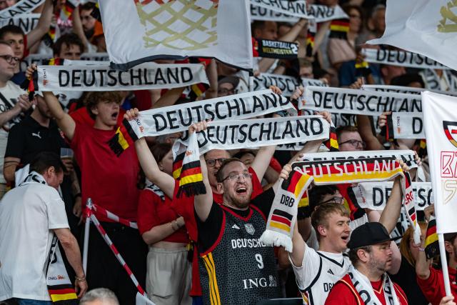 06 July 2026, Bavaria, Bamberg: German fans cheer on their team during the Basketball World Cup Qualifiers Group E Basketball match between Germany and Cyprus. Photo: Daniel Löb/dpa