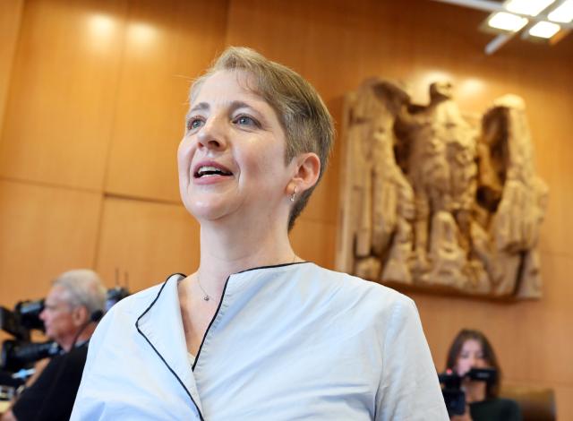 07 July 2026, Baden-Wuerttemberg, Karlsruhe: Stephanie Dilba, the petitioner in the case regarding the Bavarian Police Duties Act, waits at the Federal Constitutional Court for the oral hearing to begin. Photo: Uli Deck/dpa